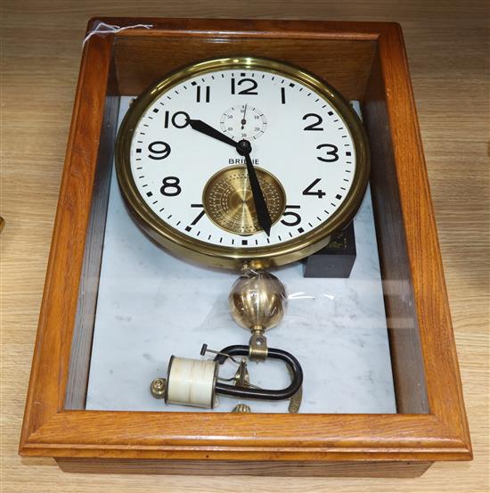 A French wall clock with oak case by Brillie, electromagnetic case 50 x 37cm